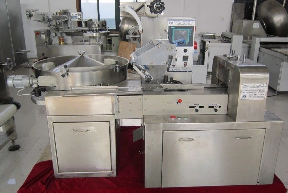 Tipo singola macchina avvolgitrice automatica del cuscino di Candy fornitore